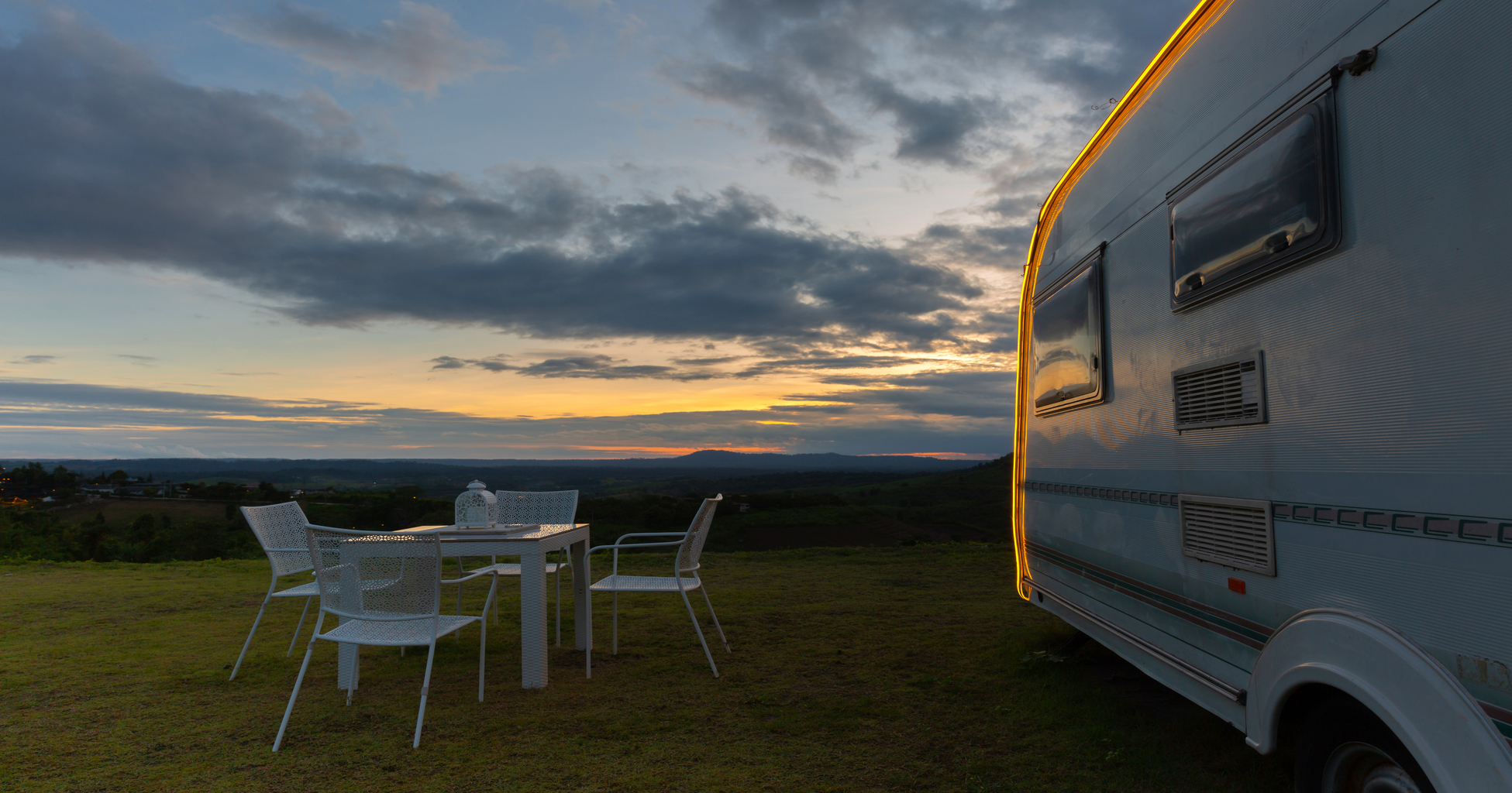campsite-with-caravans-at-dusk-time